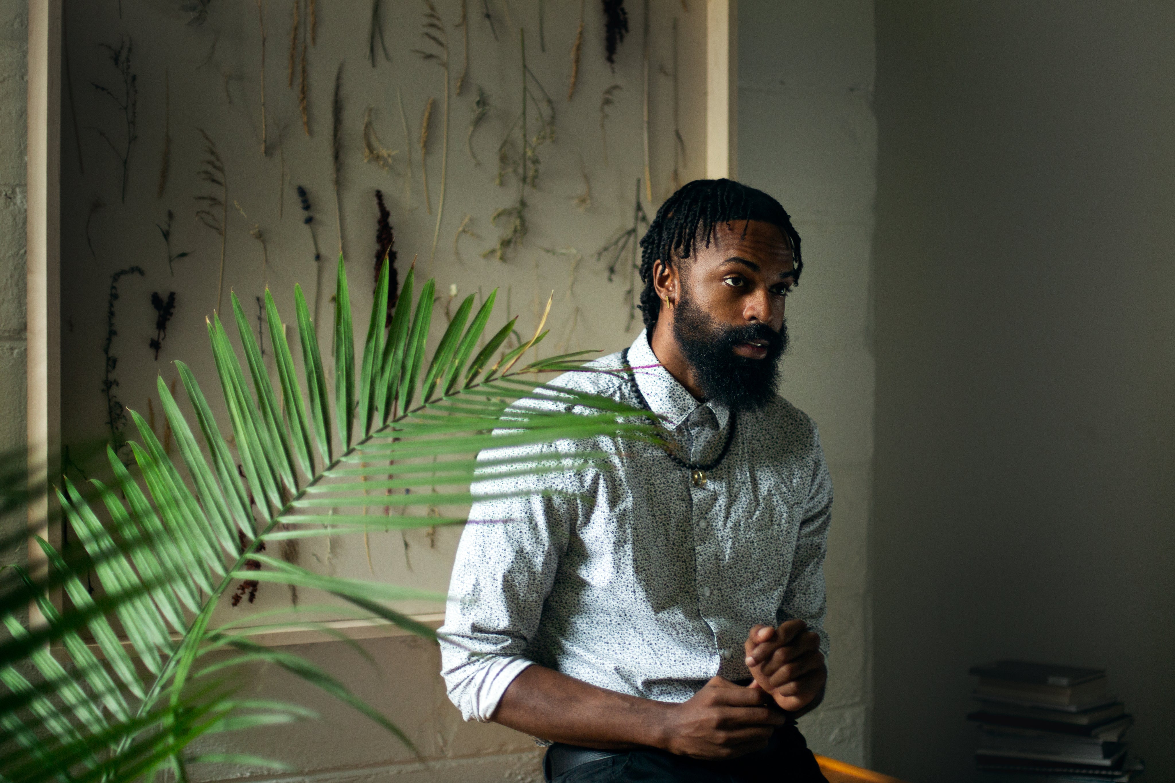 files/portrait-of-man-with-plant.jpg